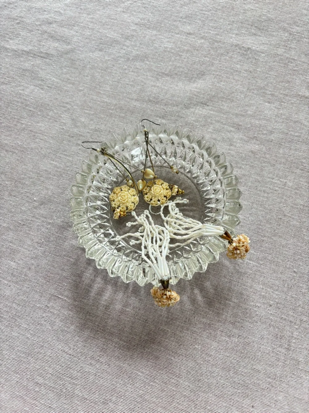 Set of three vintage cream earrings.